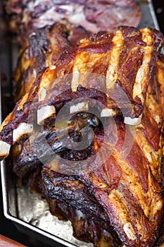 Marinated pork spare ribs, stack or pile of fresh grilled meat during barbeque, BBQ concept