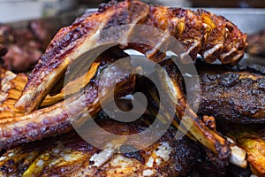 Marinated pork spare ribs, stack or pile of fresh grilled meat during barbeque, BBQ concept