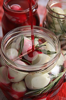 Marinated quail eggs in jars