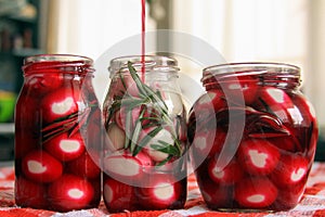 Marinated quail eggs in jars