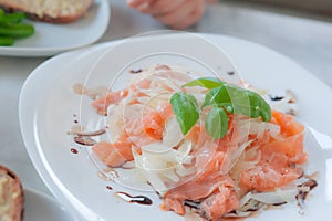 Marinated salmon carpaccio salad with basilic