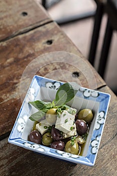 Marinated spanish olives and feta cheese tapas in barcelona restaurant