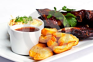 Marinated spareribs and fries photo