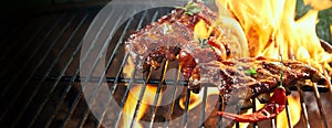 Marinated spicy pork ribs grilling on a bbq
