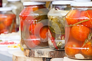 Marinated tomatoes in glass jar. Healthy snack