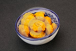 Marinated yellow patisson in the bowl