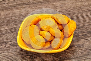 Marinated yellow patisson in the bowl