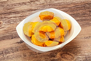 Marinated yellow patisson in the bowl