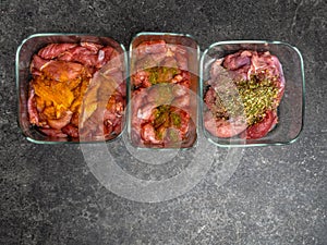 Marinating raw meat in different spices, herbs and marinades, with soy sauce and oil, with copy space