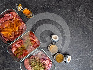 Marinating raw meat in different spices, herbs and marinades, with soy sauce and oil, with copy space