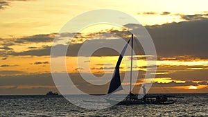 Marine beautiful nature background. Sail boats on horizon at sunset in Boracay tropical island underwater camera