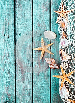 Marine border of fishnet with shells and starfish