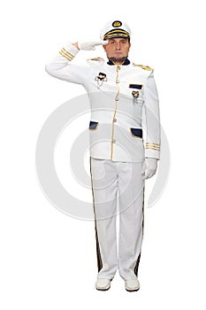 A marine captain wearing a white suit stands straight