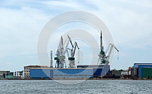 Marine cargo port. Cranes. Pula