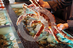 Marine crab in hand restaurateur