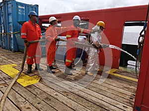 Marine  crews conduct fire drill on board ship