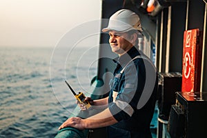 Marine Deck Officer or Chief mate on deck of offshore vessel or ship , wearing PPE personal protective equipment