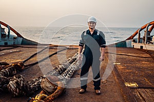 Marine Deck Officer or Chief mate on deck of offshore vessel or ship , wearing PPE personal protective equipment