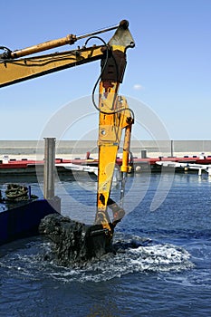 Marine dredging digging sea bottom black mud