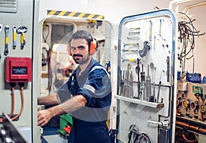 Marine engineer officer working in engine room
