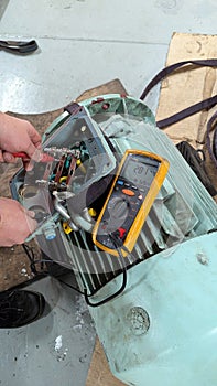 Marine Engineer Performing Megger Insulation Resistance Test on Electric Motor