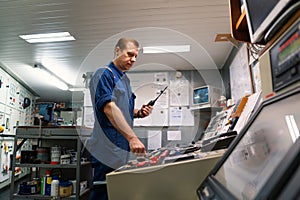 Marine Engineer working on radio communication at Engine Control room ECR