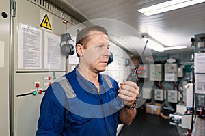 Marine Engineer working on radio communication at Engine Control room ECR