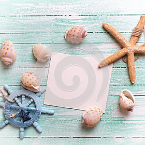 Marine items and empty tag on turquoise wooden background.