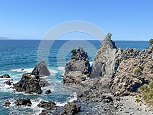 Marine Landscape. The view of rocky coastline at Tawharanui Regional Park in a sunny day, New Zealand