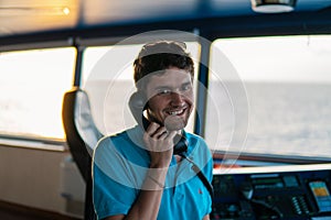 Marine navigational officer is reporting by VHF radio photo