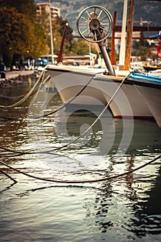 Marine port with moored yachts and boats in sea during sunset