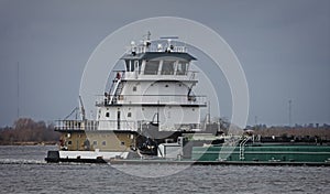 Marine push boat or tug boat in river with barge