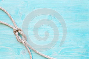 Marine rope on the background of blue boards