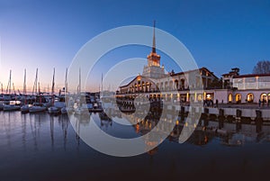 Marine Station in Sochi with boats on the pier with calm water.