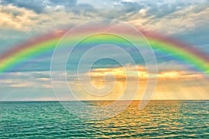 Marine sunset with a rainbow