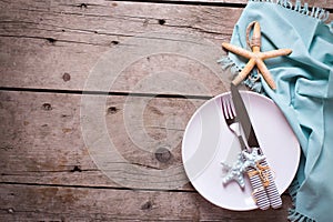 Marine table setting on aged wooden background. Selective focus.
