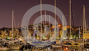 Many yachts and fishing boats in the night, cityscape