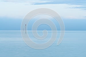 Marine warning sign. Cloudy blue minimalist seascape