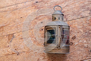 A mariners lamp on an old wood floor