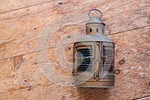A mariners lamp on an old wood floor photo