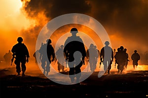 Marines in action, silhouetted by a fiery sunset, advance through smoke