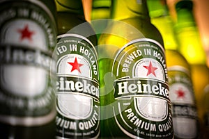 Marinette,WI / U.S.A. - Aug16,2019: Cold bottles of Heineken Beer with drops over green background. Heineken is the flagship produ
