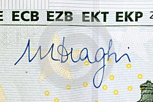 Mario Draghi`s signature on 100 Euro banknote. Mario Draghi is president of the European Central Bank photo