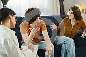 Marital Psychotherapy. Man and woman having conflict and quarrel during therapy session