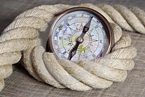 Maritime compass and rope photo