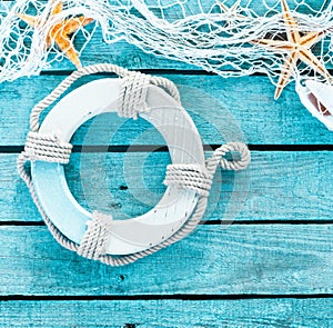 Maritime decoration with a life ring and fishnet