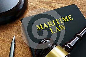 Maritime law black book and gavel. photo