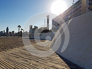 Maritime walk on the Levante beach of Benidorm. View from the beach level to the top of the promenade and the frontline buildings
