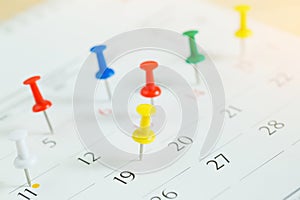 Mark the event day with a pin. Thumbtack in calendar concept for busy timeline organize