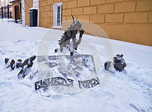 The marker sculpture composition of two flea dogs on the Lousy hill in winter. Nizhny Tagil. Russia